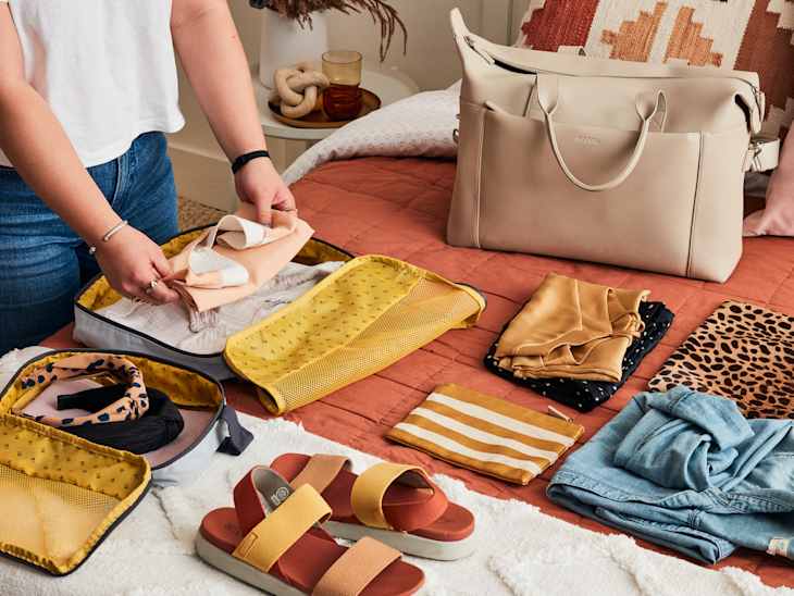 shot of someone packing a duffle bag