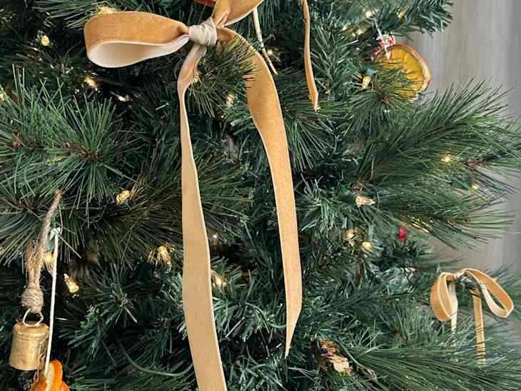 Christmas tree with hand-tied gold velvet bows