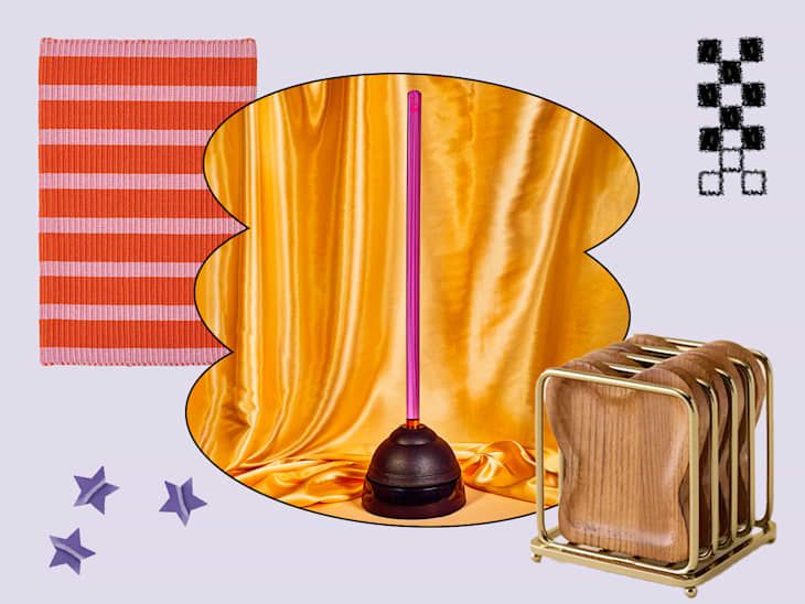 Colorful striped rug in orange and pink, a pink lamp on a black base, golden satin backdrop, and wooden coasters in a gold holder.