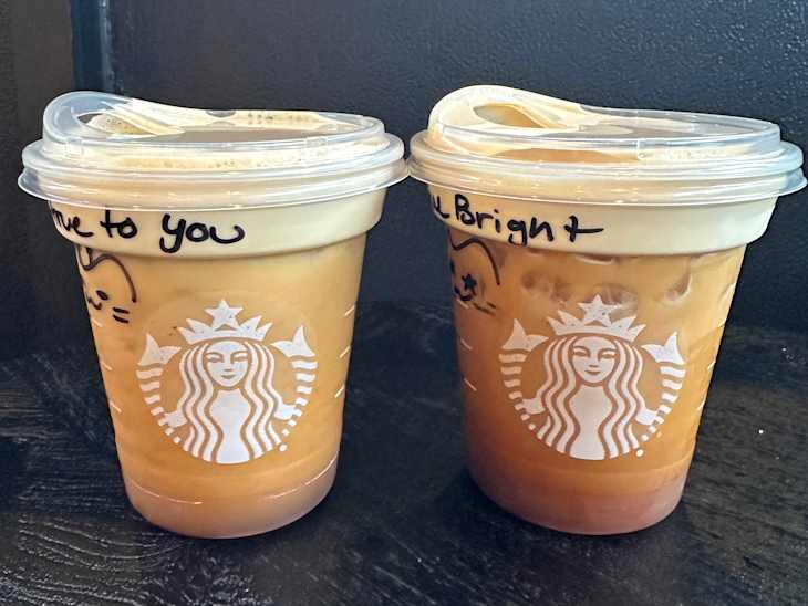Starbucks Caramel and Regular Aerocano drinks on table