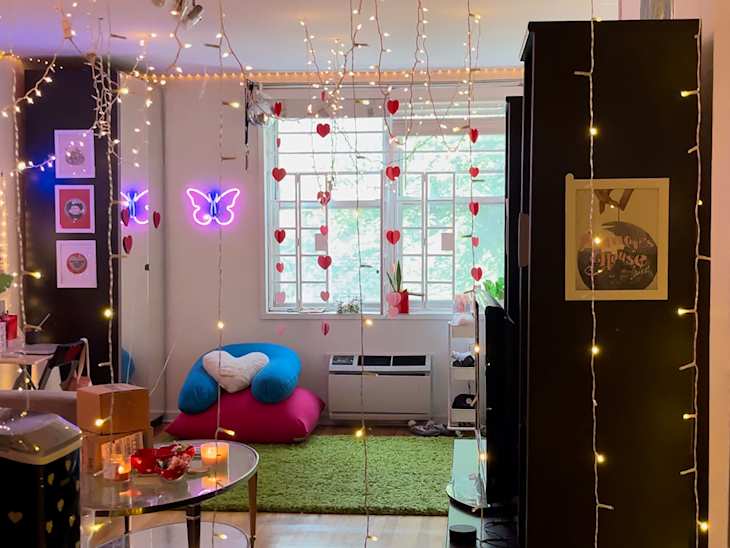 view into dorm room with lots of string lights and windows