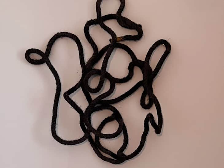 Wall with black rope art