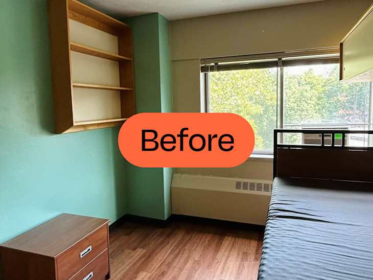 mostly unfurnished dorm room with one green wall and other beige walls before makeover