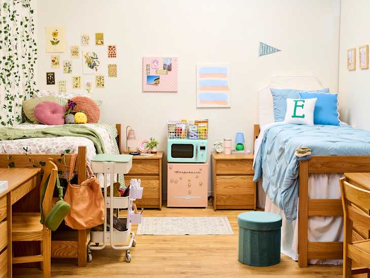wide shot of two sides of a dorm room where one is cottage core and one is preppy