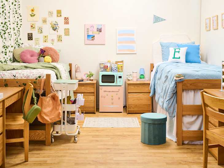 wide shot of two sides of a dorm room where one is cottage core and one is preppy