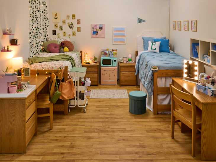 wide shot of two sides of a dorm room where one is cottage core and one is preppy