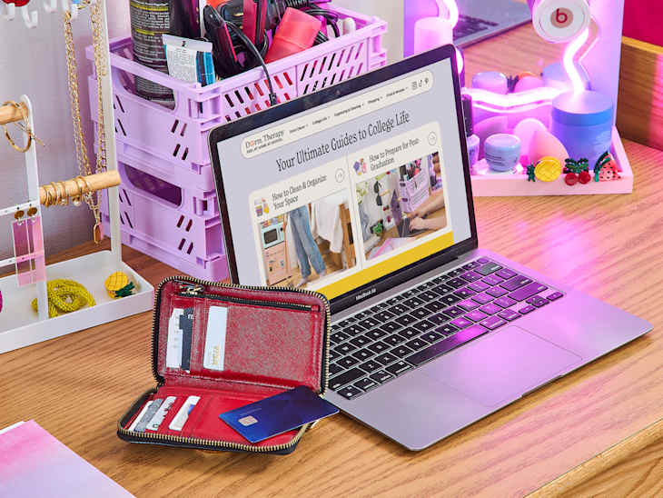 computer on desk with wallet