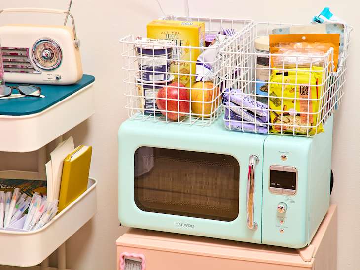 snacks in caddies on top of microwave in dorm room