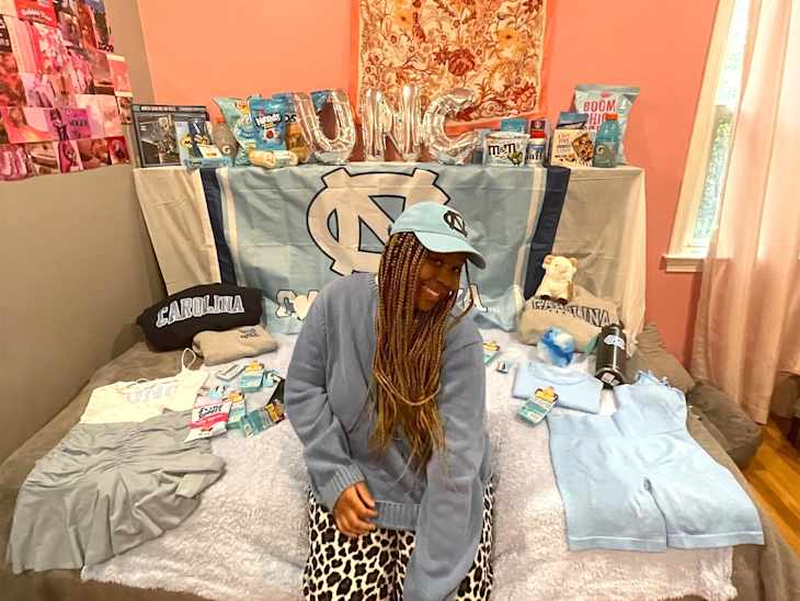 College student in decorated dorm room.