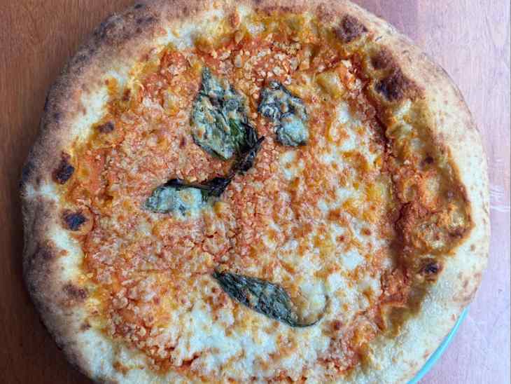 Genio pizza on plate.