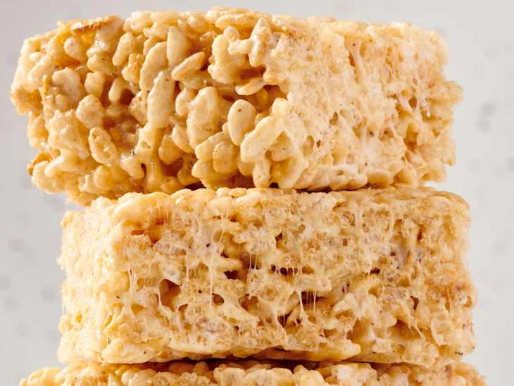 stack of three rice krispy treats on a marble surface