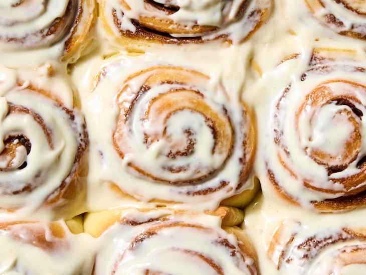 overhead shot of cinnamon rolls with icing
