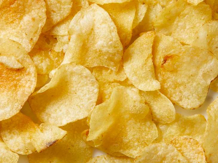 Close up view of a pile of kettle chips.