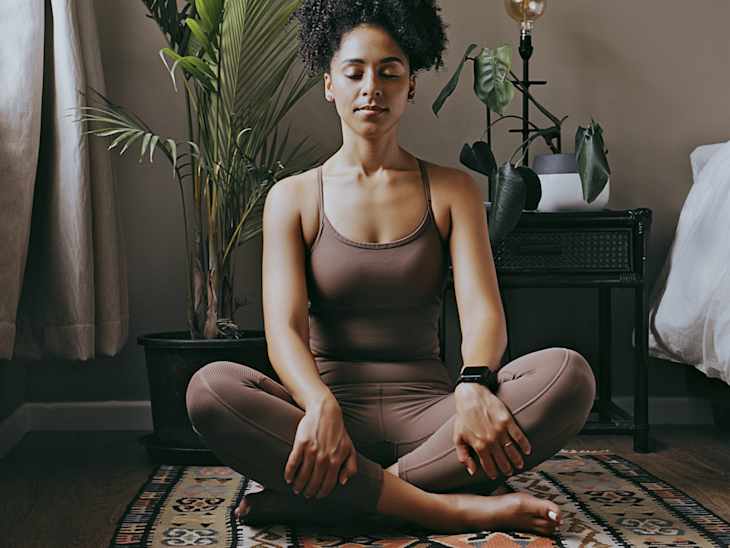 Zen, relax and mediation with black woman and yoga in bedroom for calm, peace and morning routine. Wellness, breathing and balance with health girl training at home for spiritual, healing and energy