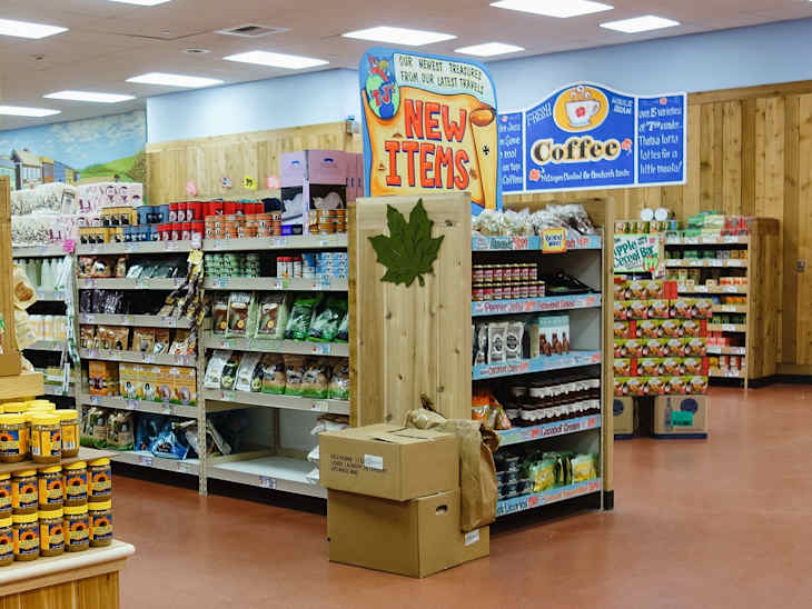 Shelves with products and ailes with special offers and new food items inside Trader Joe's grocery store, a American supermarket chain owned by German discount retailer Aldi