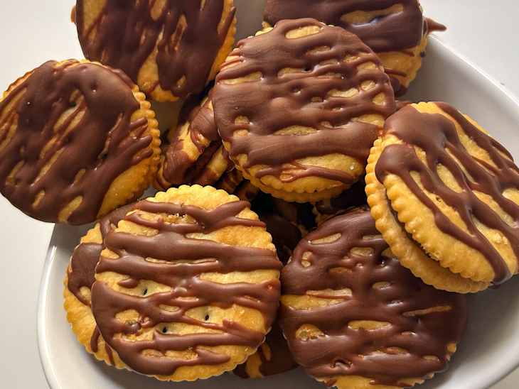 "Billion Dollar Ritz" sandwich cookies made from Ritz crackers, Rolos candy, and melted chocolate chips