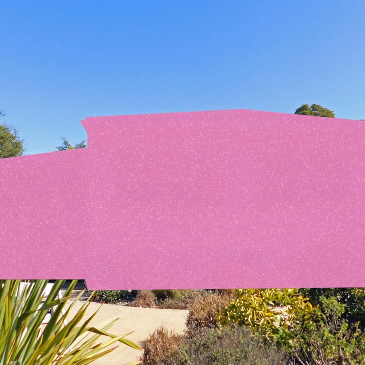 Pink silhouette of a house over a garden with various green plants and trees.