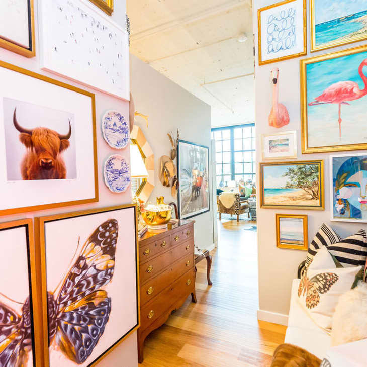 A gallery-style hallway covered with framed art