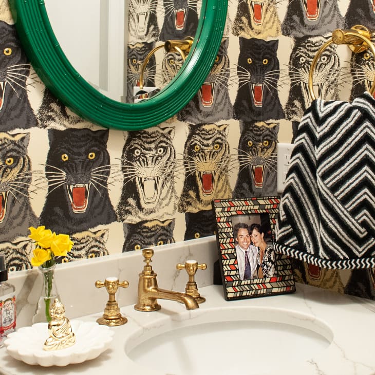 Half bath with tiger wallpaper