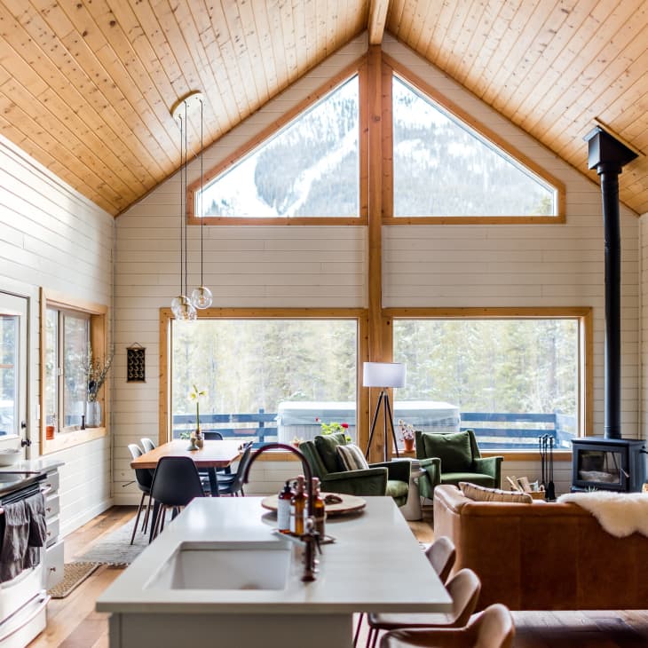 Open living and kitchen space with large windows