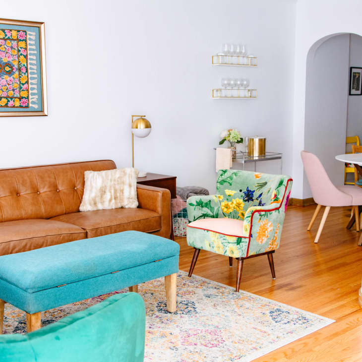 Bright living room with leather sofa and teal accents