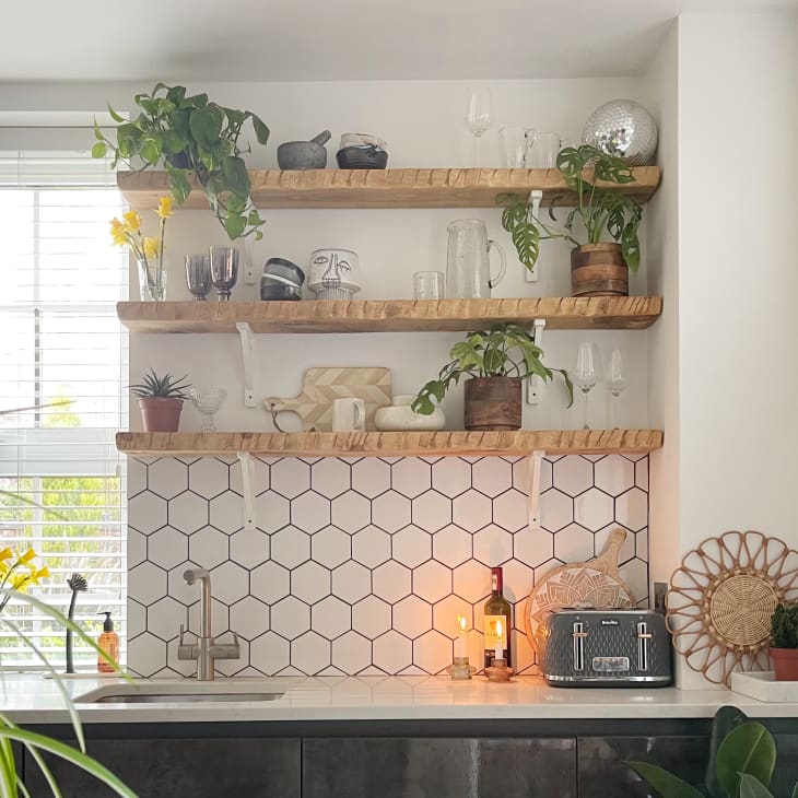 Kitchen with white hex backsplash and open shelving