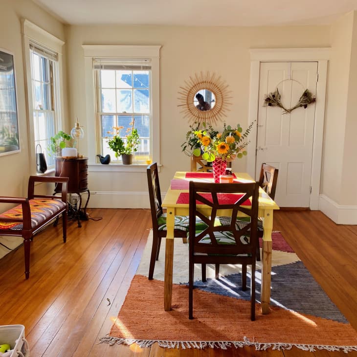 Bright dining room with table in center of room