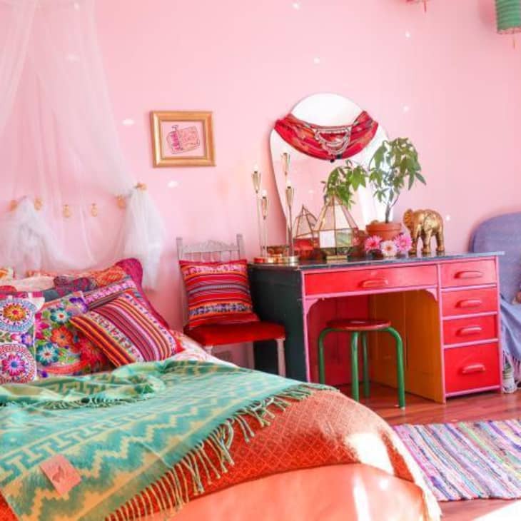 Bedroom with red vanity and pink walls