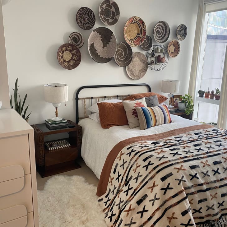 Bedroom with basket wall above headboard