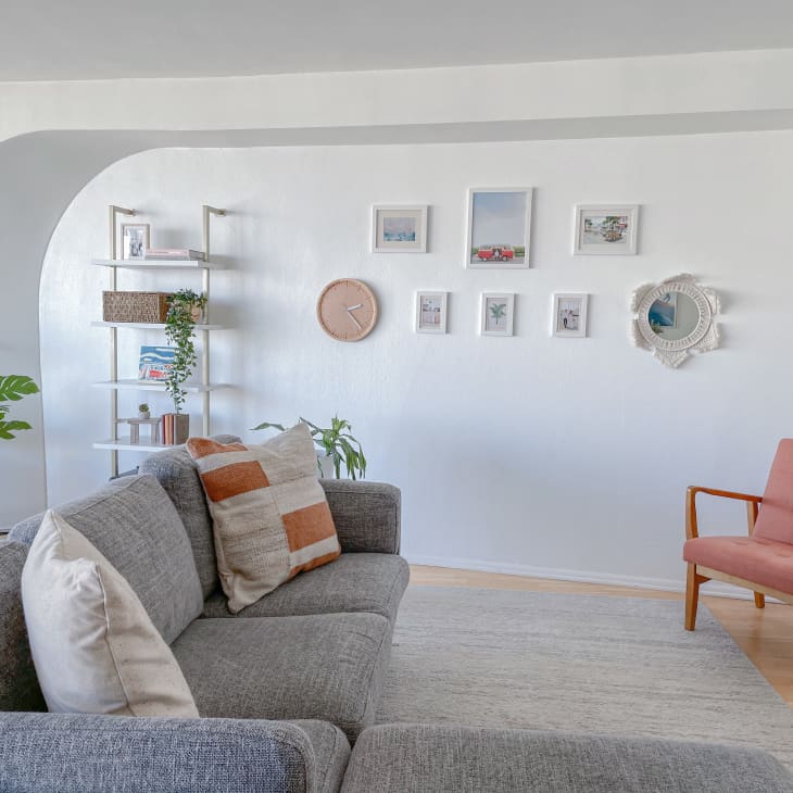 living room with couch and pink chair