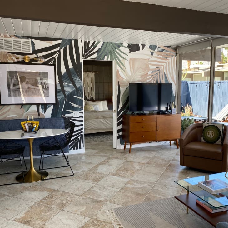 Living room with palm leaf wallprint