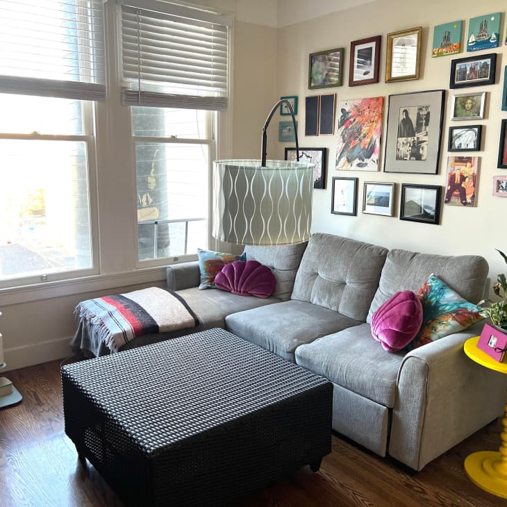 Living room with gray sectional couch and gallery wall