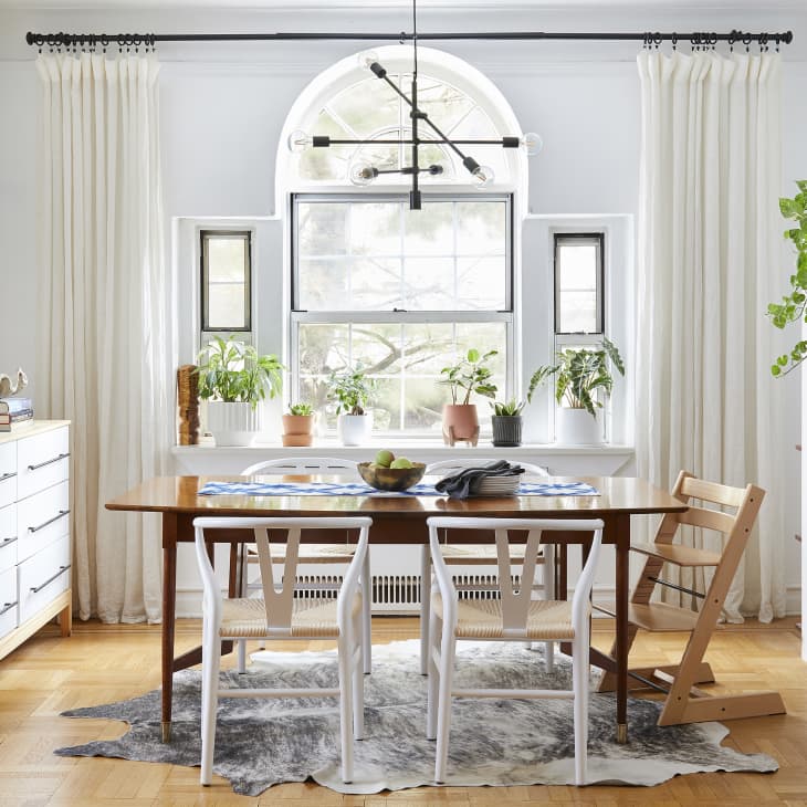 Dining table next to table and shelves