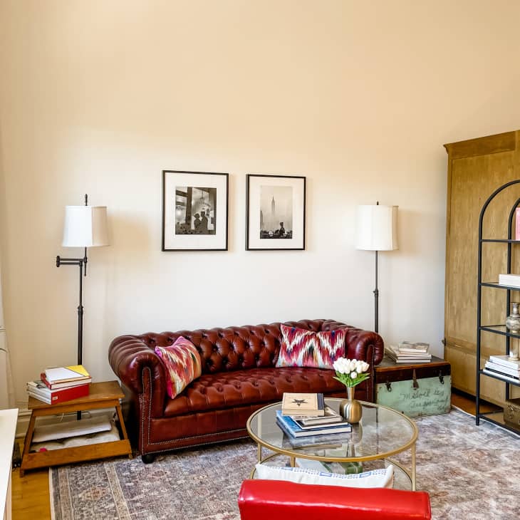 Large living room with leather chesterfield sofa.
