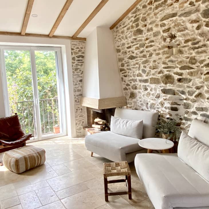 Living room with exposed stone walls
