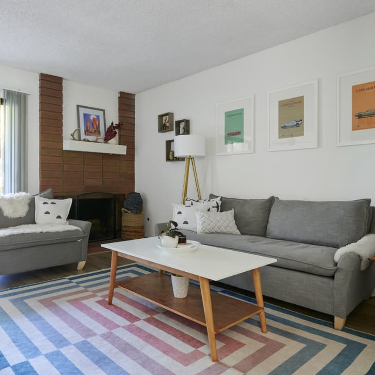 A large living room with gray sofas