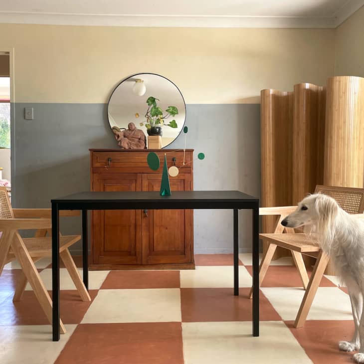 dining room with brown and off white tiled floor, minimal furnishings, Saluki dog