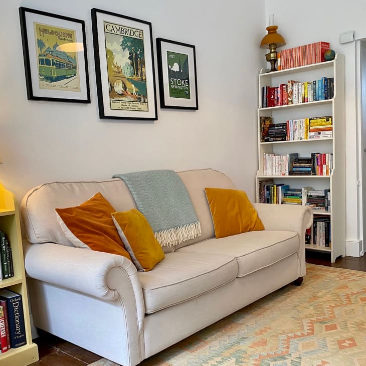 Bookshelves in living room with cream sofa.