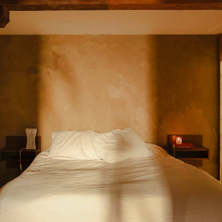 Bedroom with glass block wall.