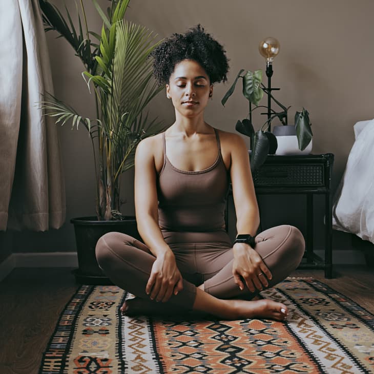 Zen, relax and mediation with black woman and yoga in bedroom for calm, peace and morning routine. Wellness, breathing and balance with health girl training at home for spiritual, healing and energy