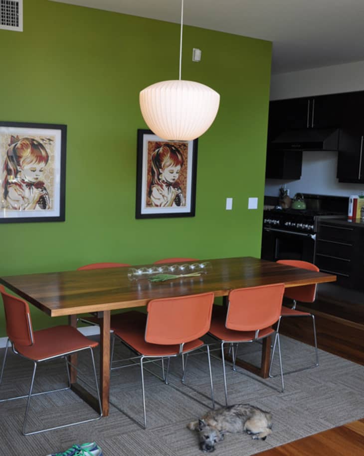 green dining room with brown table