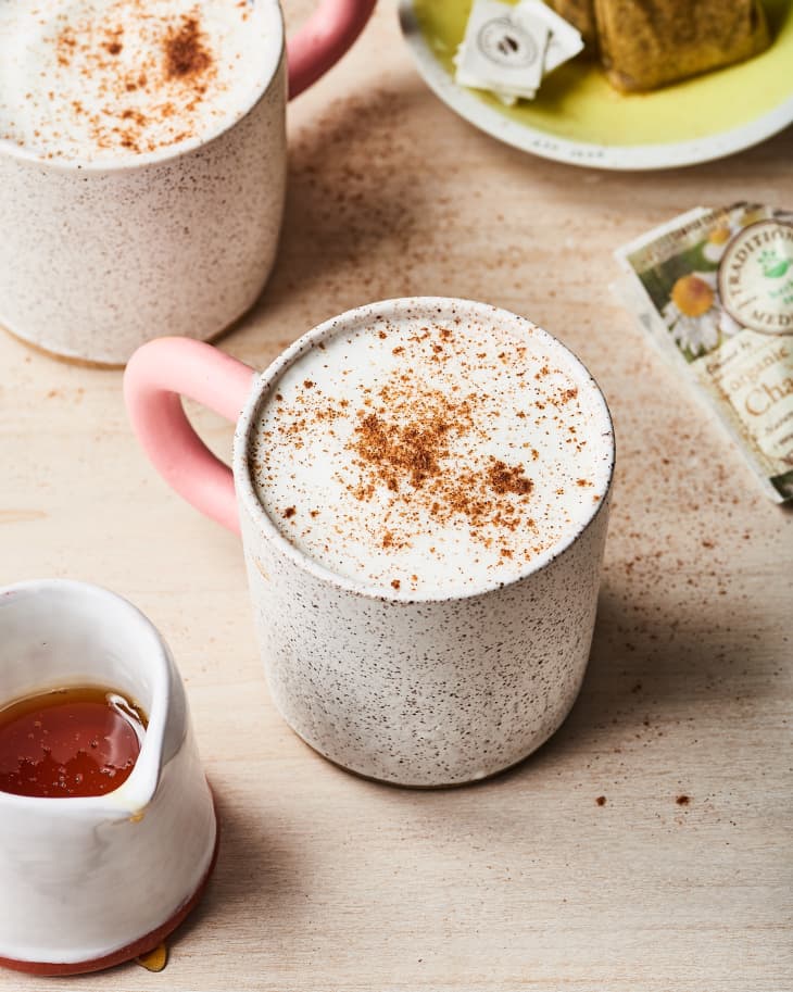 Honey chamomile tea latte, sprinkled with ground cinnamon, in a mug