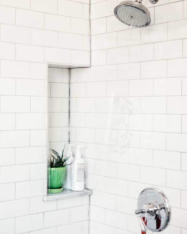 Running shower to rinse off any remaining cleaning solution