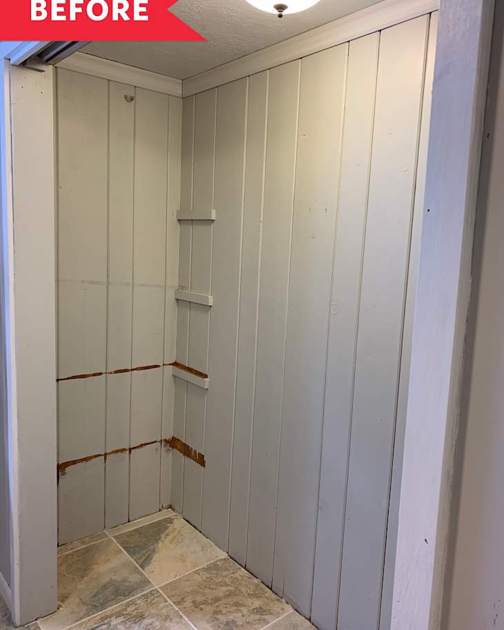 A boring empty gray closet with tile flooring