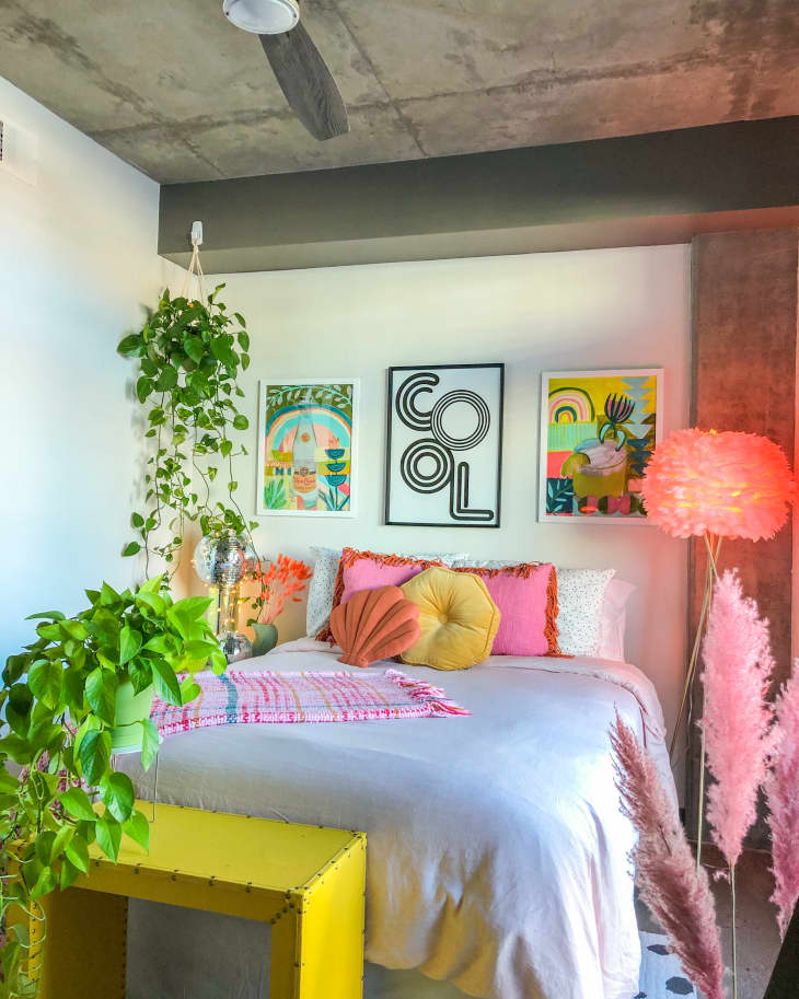 Bedroom with plants and pink lights
