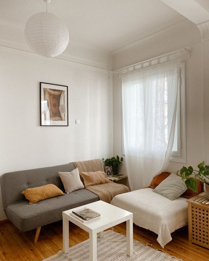 Living room with white walls and gray sofa