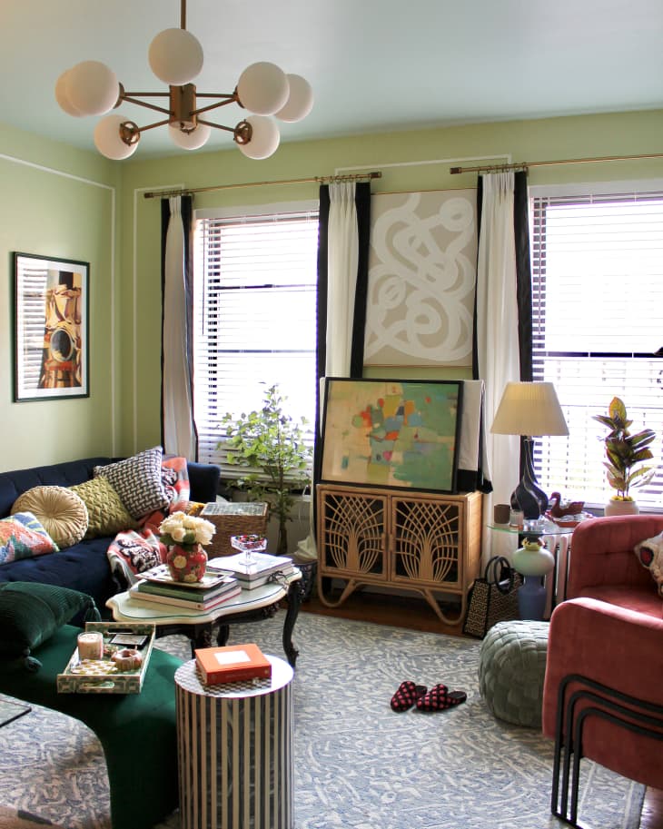 Pendant hanging in light green living room.