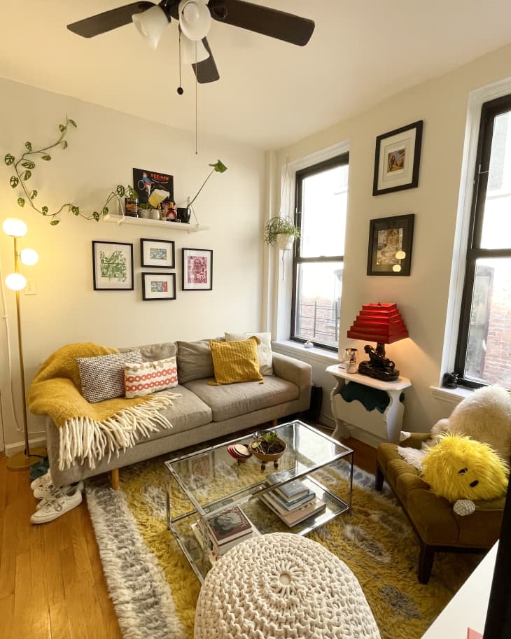 Sunset Brooklyn apartment with yellow blankets and rugs.