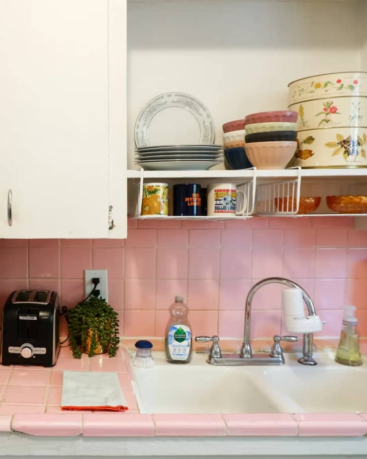 pastel pink backsplash in the kitchen with vintage details