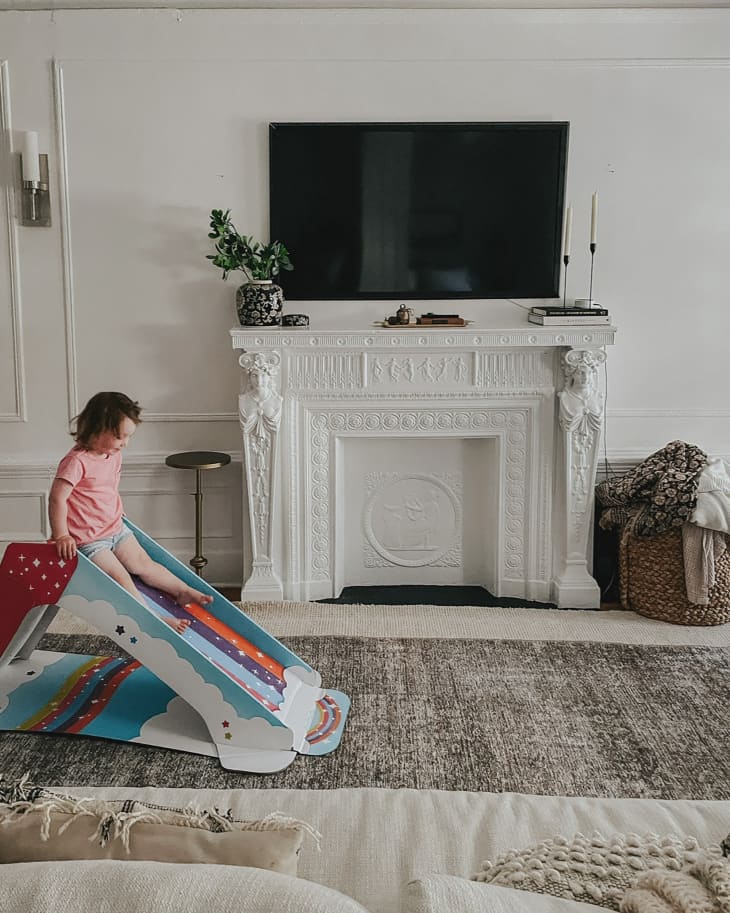 Toddler playing on Pop2Play kids slide.